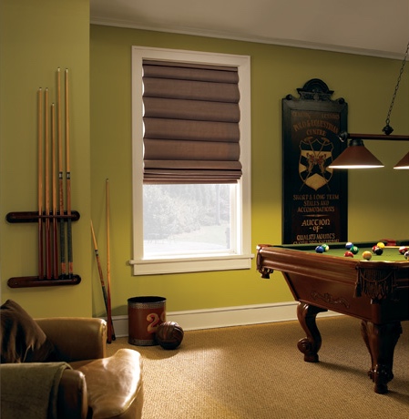 Roman shades in Clearwater game room with green walls.